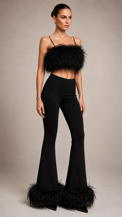 Model wearing a black feathered top and flared pants