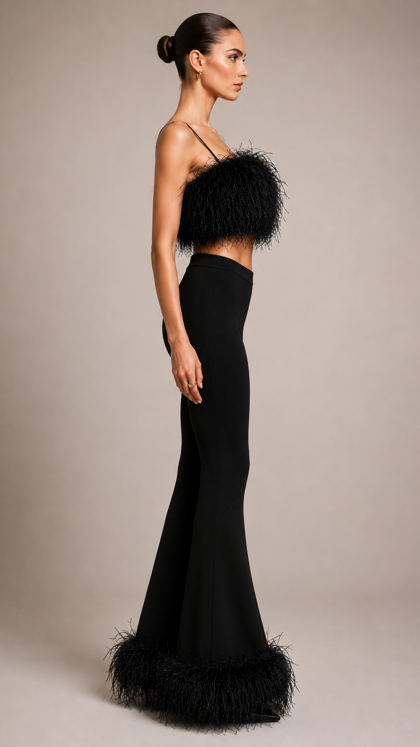 Woman wearing a black evening gown with feathered details
