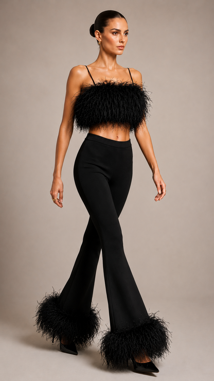 Woman wearing a black outfit with feathered details