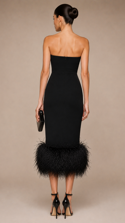 Woman wearing a black strapless  feathered dress